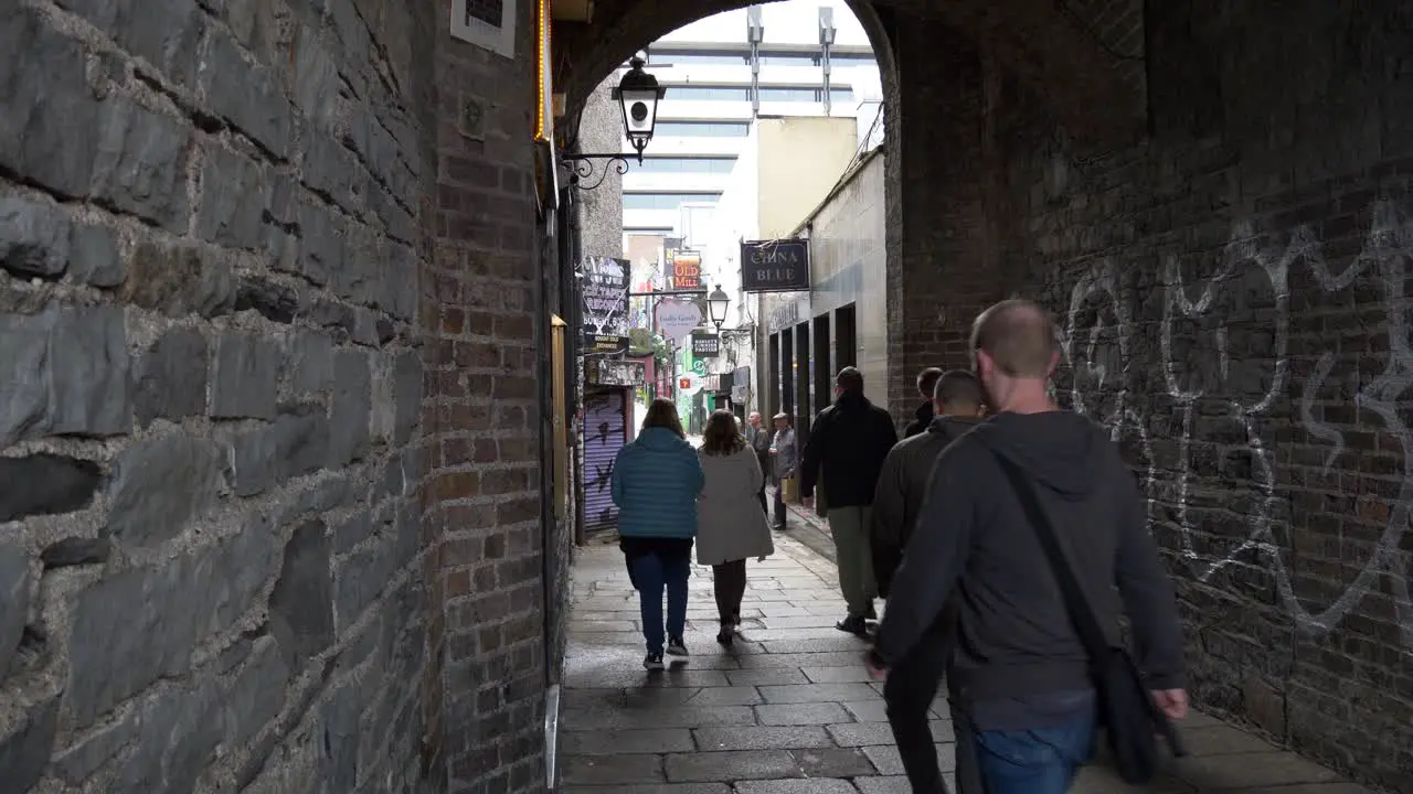 Many People Entering The Famous Street Of Temple Bar District For A Pint Of Guinness In Dublin Ireland