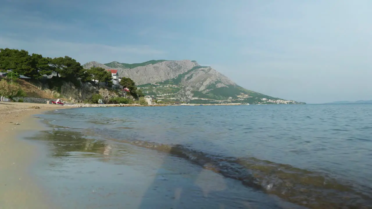 4K Cinematic nature travelling footage of a panoramic view of the cliffs and mountains of Omis next to Split Croatia on a sunny day