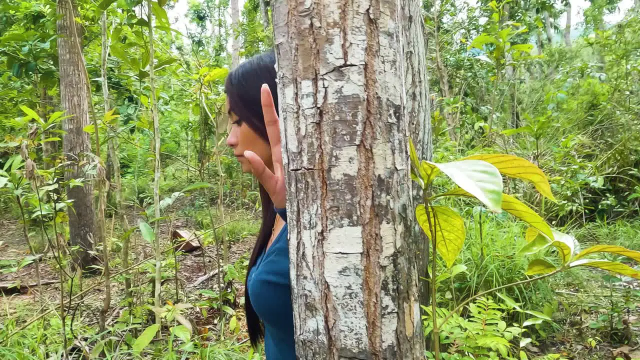 Lone Woman Isolated In A Forest With Tropical Trees During Daytime