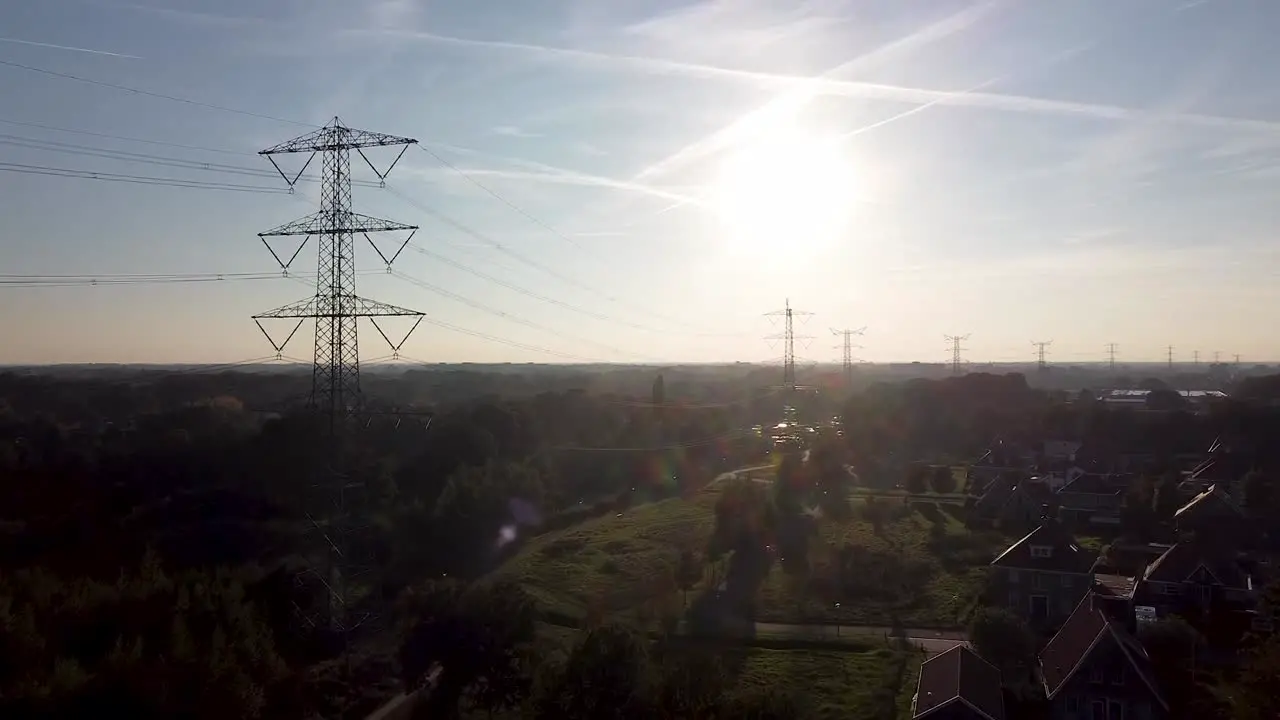 Drone shot of a sunset in a village on the edge of a forest