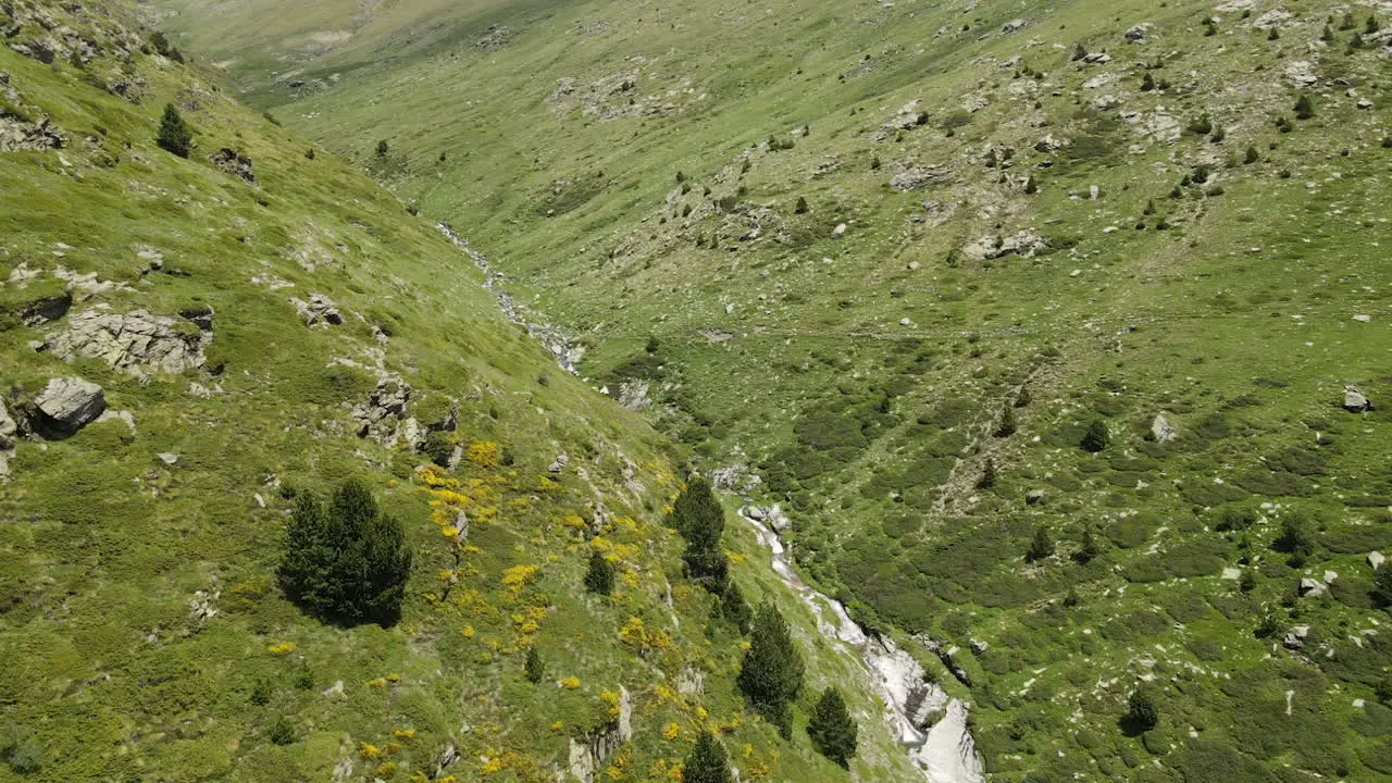 Aerial View Of A Drone Following A Trail Located Between The Slopes Of Two Pyrenean Mountains