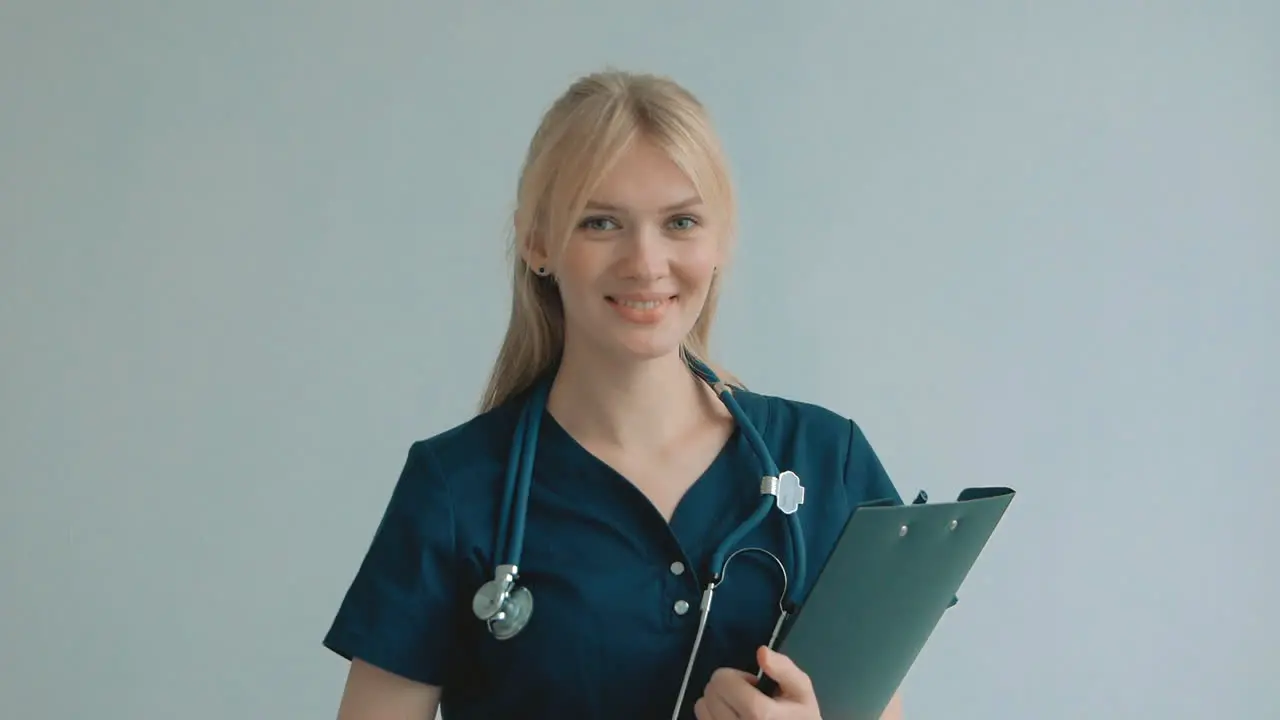 Portrait Of Young Pretty Blonde Female Nurse Care Taker Smiling