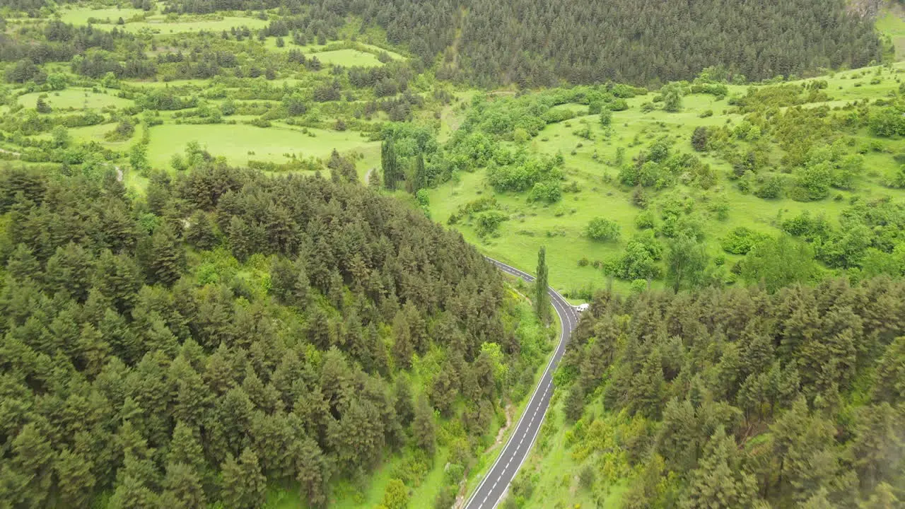 Aerial Drone View Of A Mountain Road In The Pyrenees Leading Into A Beautiful Valley