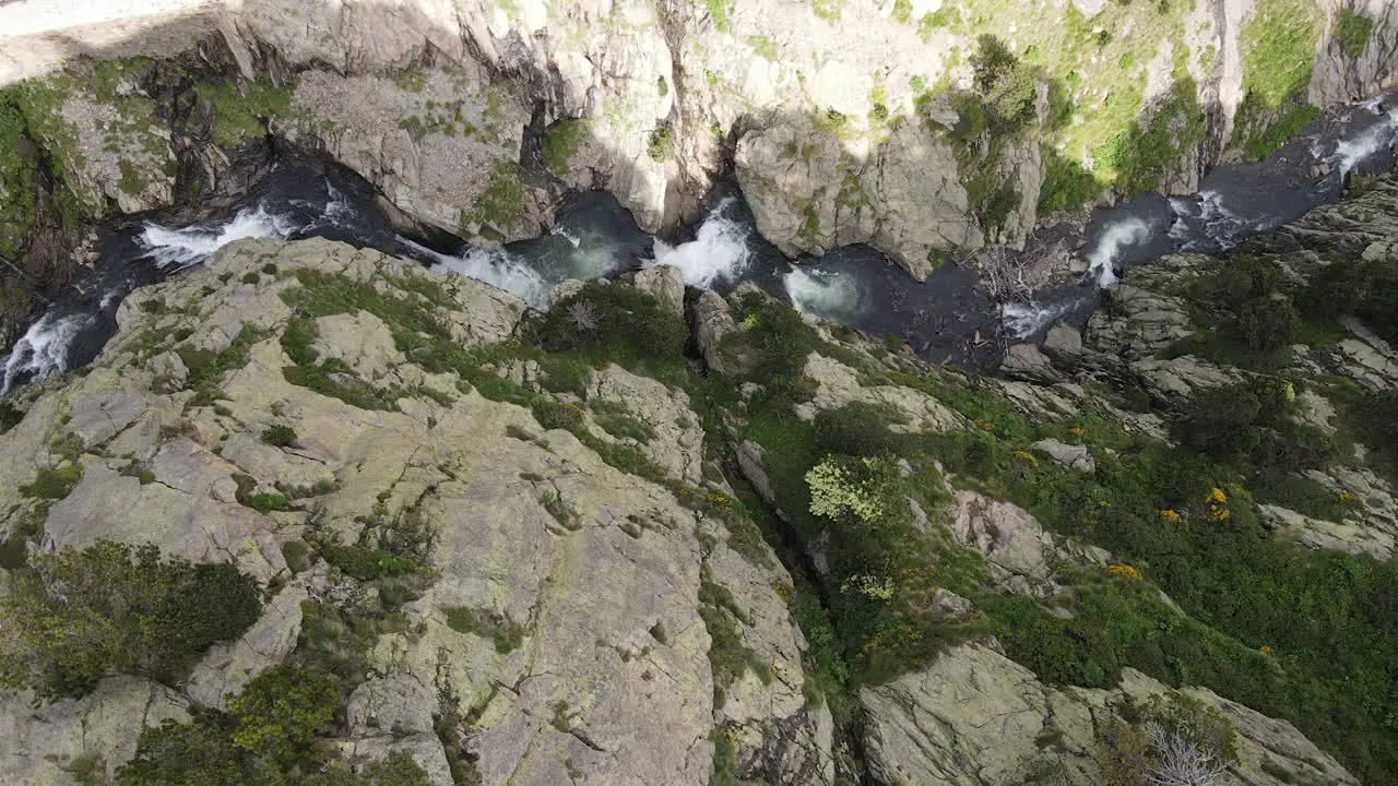 Top Aerial Shot Of A Mountain Gorge Through Which Flows A Rushing River 1