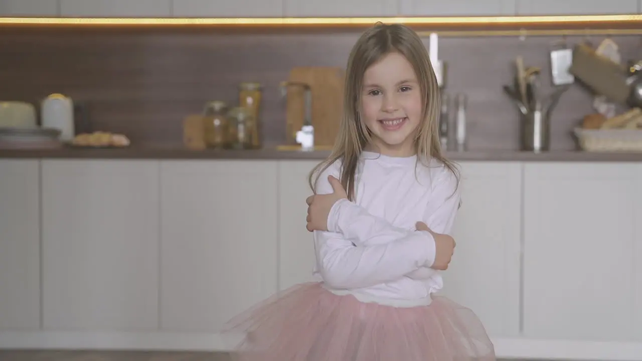 Happy Little Girl Dressed As Princess Posing At Home