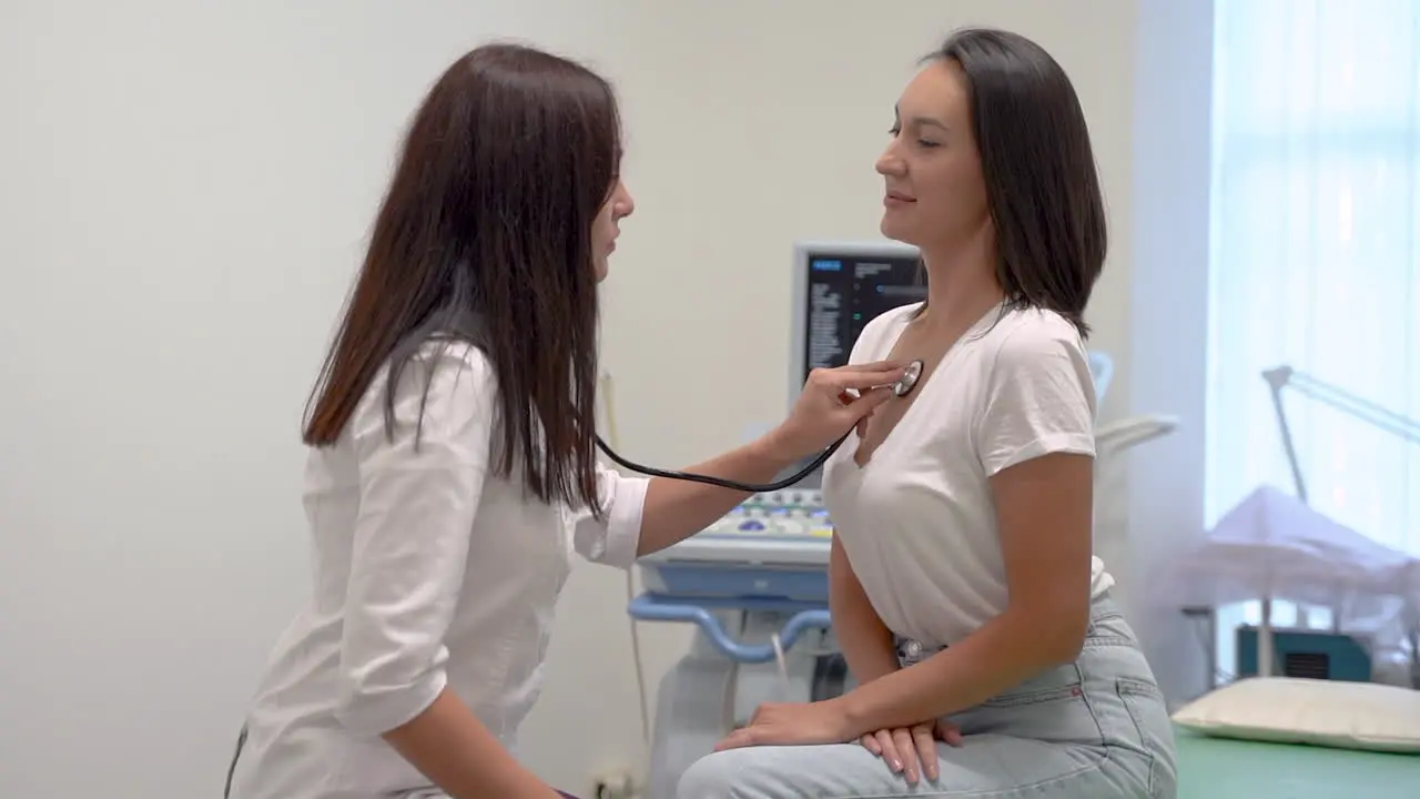 Female Doctor Listening The Heart Beat Of A Patient With The Stethoscope Checking The Health