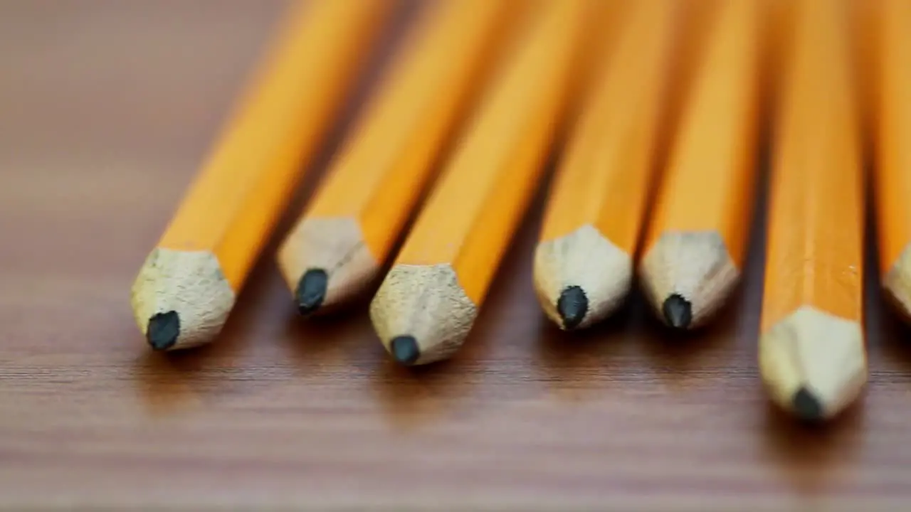 Pencils on Table Panning Shot