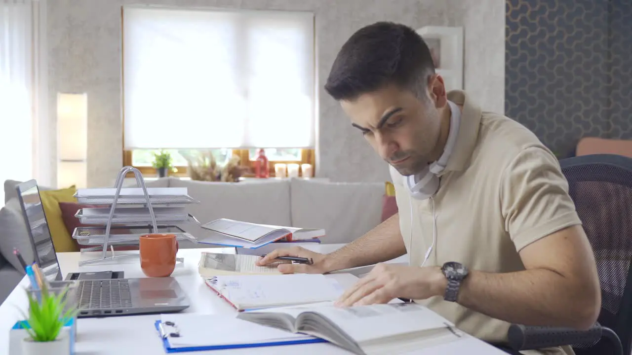 Businessman looking at computer screen rejoices and is happy