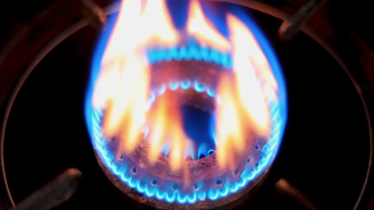 Firing the gas burner with a lighter Close up