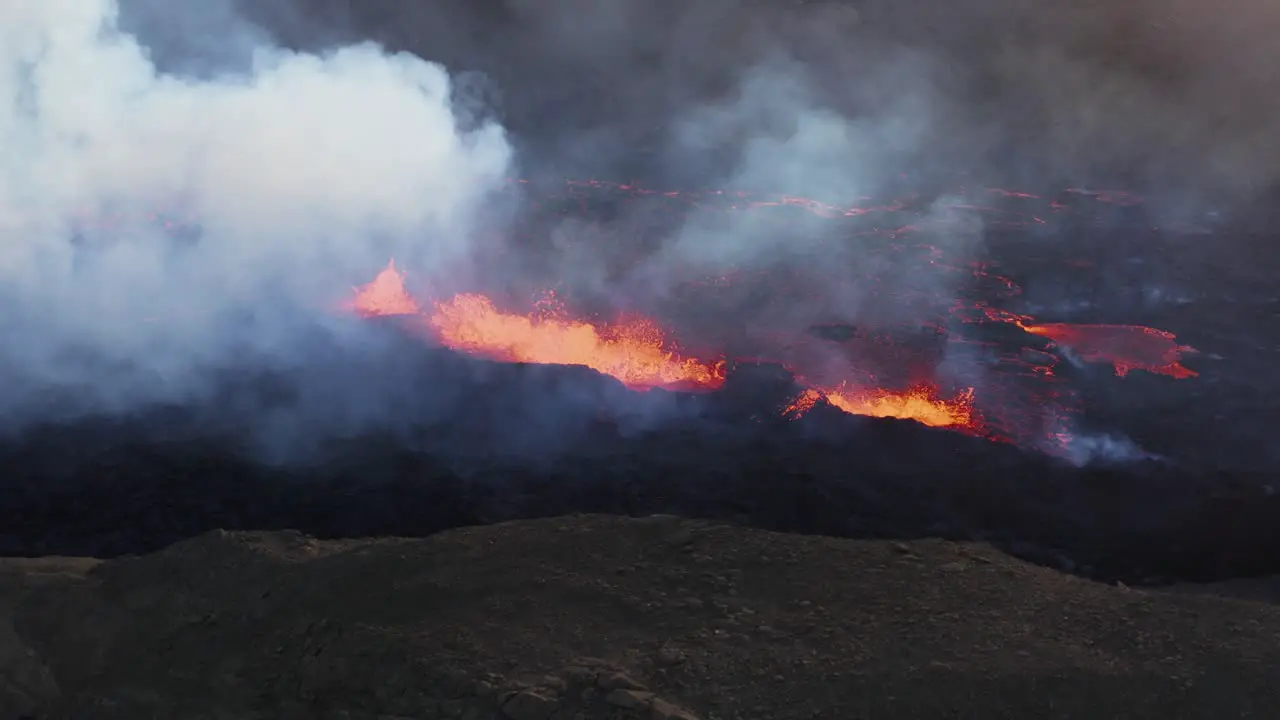 Dangerous geothermal landscape with molten lava spewing from earth surface Fagradalsfjall Iceland