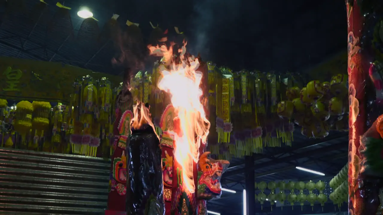 Slow motion shot of burning incense at a temple in Thailand