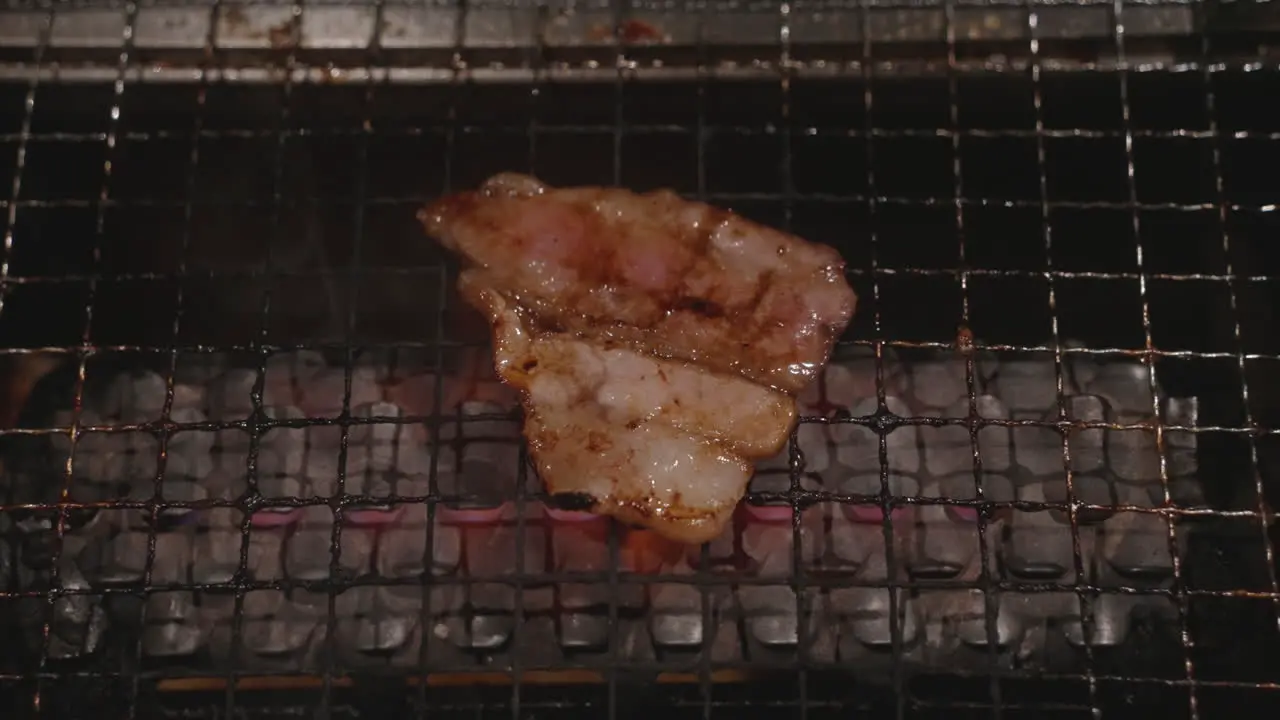 A Piece Of Pork Grilled On The Flaming Grill