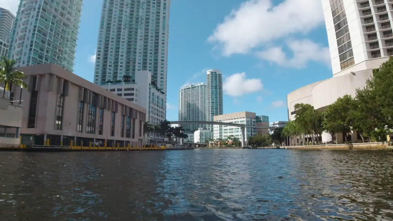 view of Miami florida by boat with tall buildings along the waterways