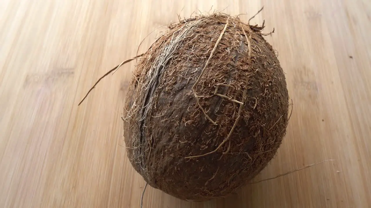 Coconut close up on Wooden background isolated 4K