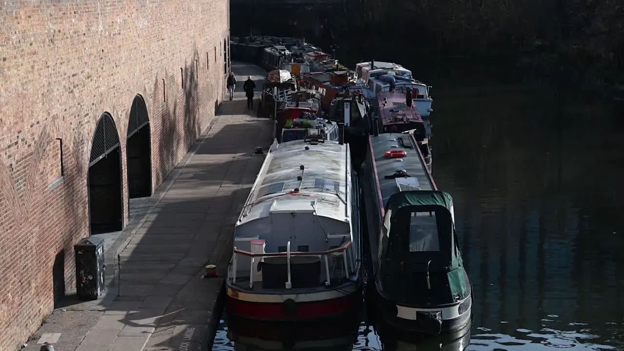 A Run Along The Canal Past The Boats London United Kingdom