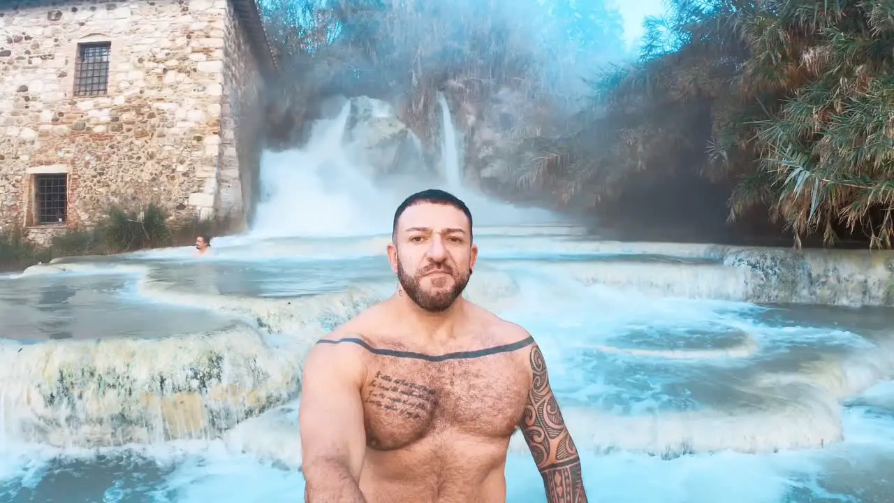 man bathing in the baths of saturnia