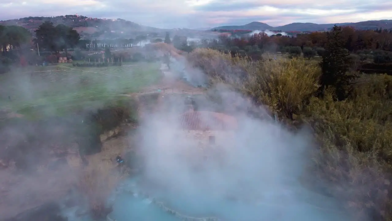 The geothermal thermal hot springs bath and waterfall at Saturnia Tuscany Italy close to Siena and Grosseto by sunrise