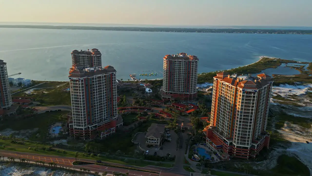 An aerial view of Portofino Towers on Pensacola Beach via drone showing the beautiful scenery of this tropical paradise