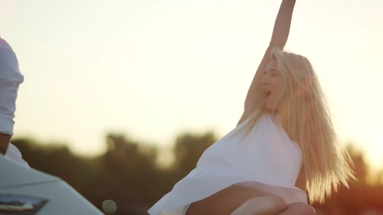 Cheerful young woman with boyfriend have fun on yacht