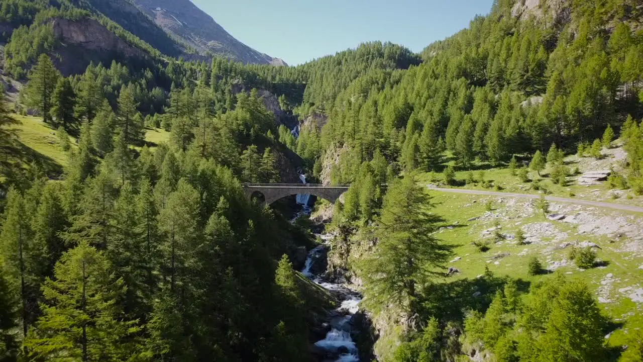 Droneshot of Mountain water waterfalls in france near Barcelonnete french alps mountain pass