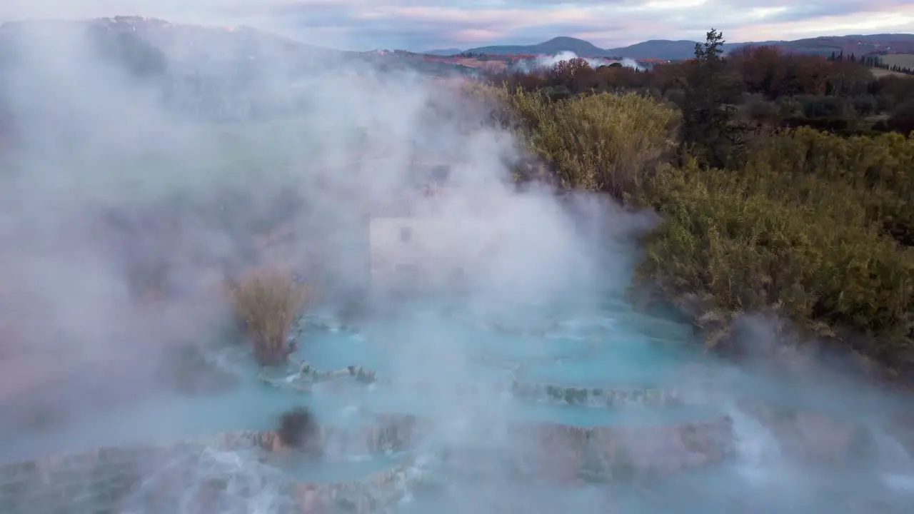 The geothermal hot springs bath and waterfall at Saturnia Tuscany Italy close to Siena and Grosseto at sunrise