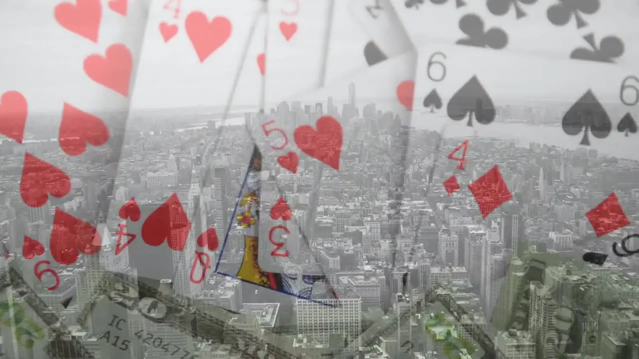 Animation of casino playing cards over cityscape