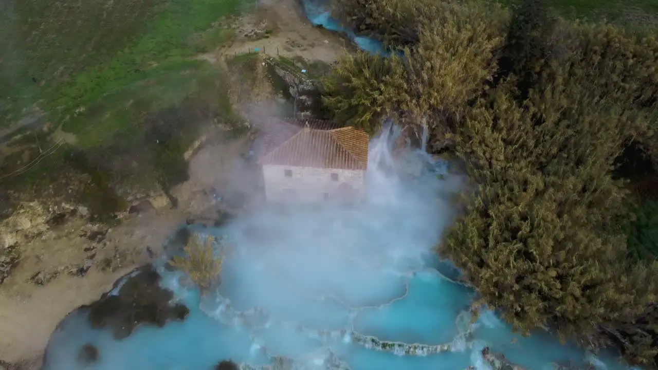 The thermal hot springs bath and waterfall at Saturnia Tuscany Italy close to Siena and Grosseto at sunrise