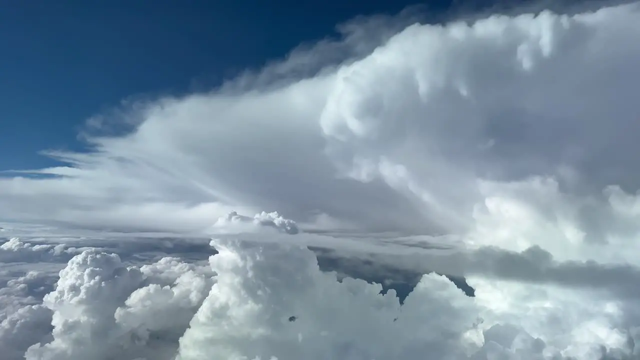 Impressive view of a threatening cumulonimbus ahead in the route of a jet flting at 12000 metres high