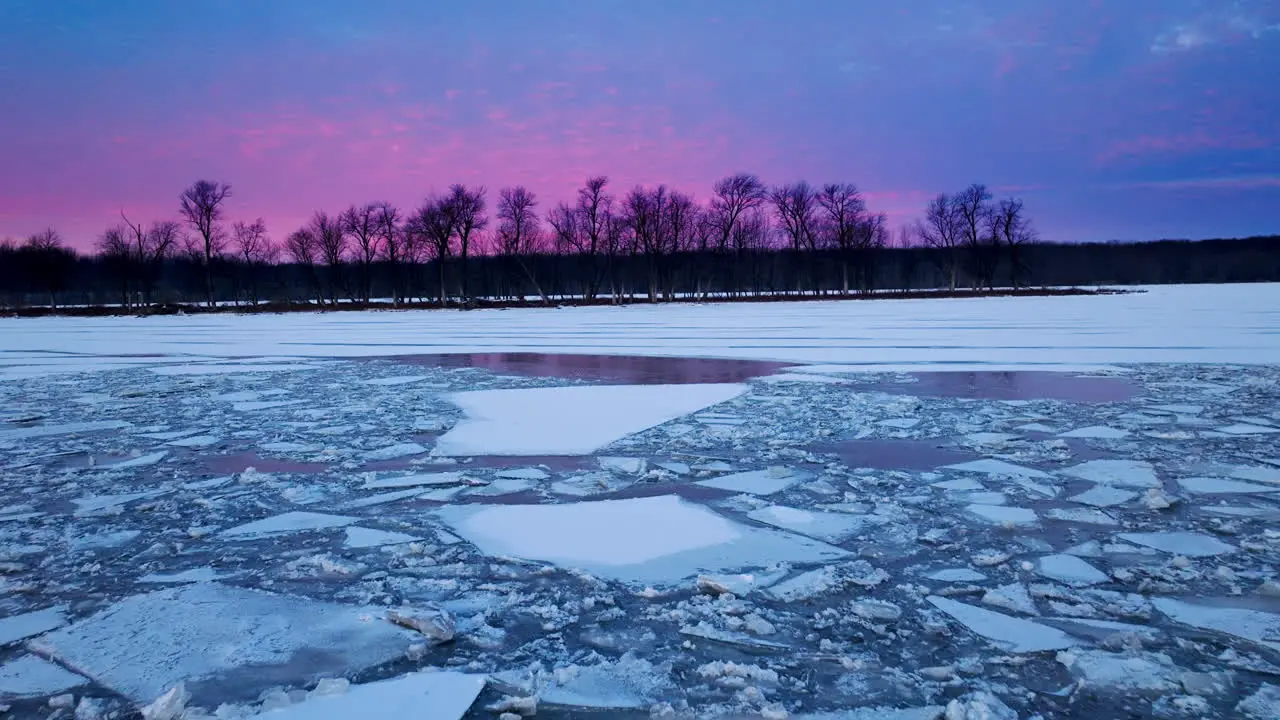 Drone's vantage point as it traverses gigantic ice chunks in the water