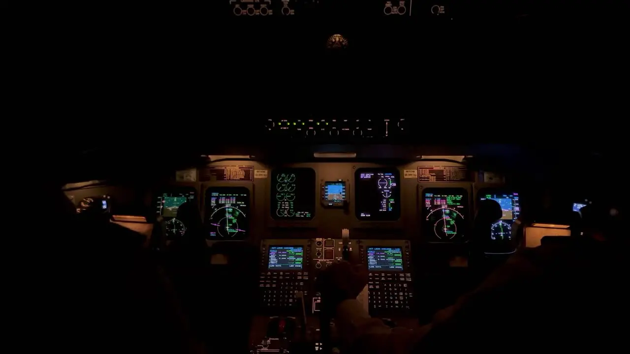 Jet cockpit view in a real flight though stormy clouds with turbulence and lightnings night light