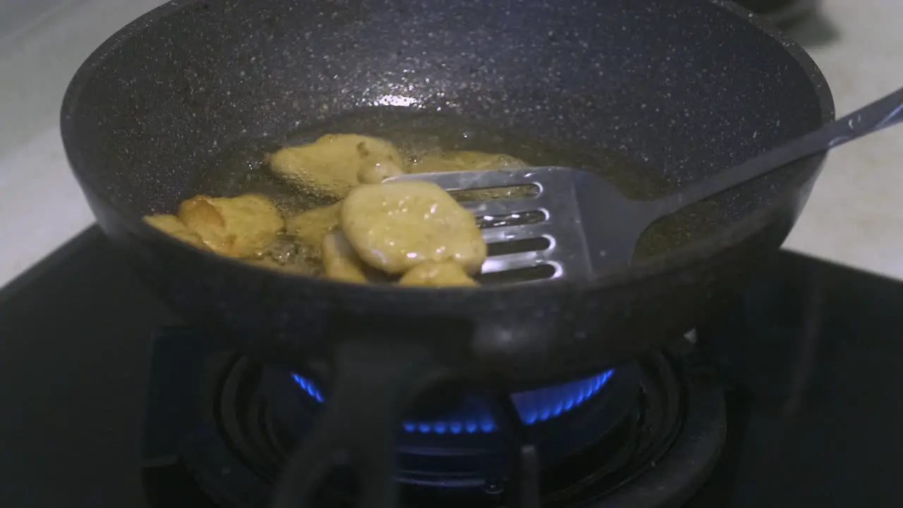 Closeup Shot of Frying Nuggets in a wok