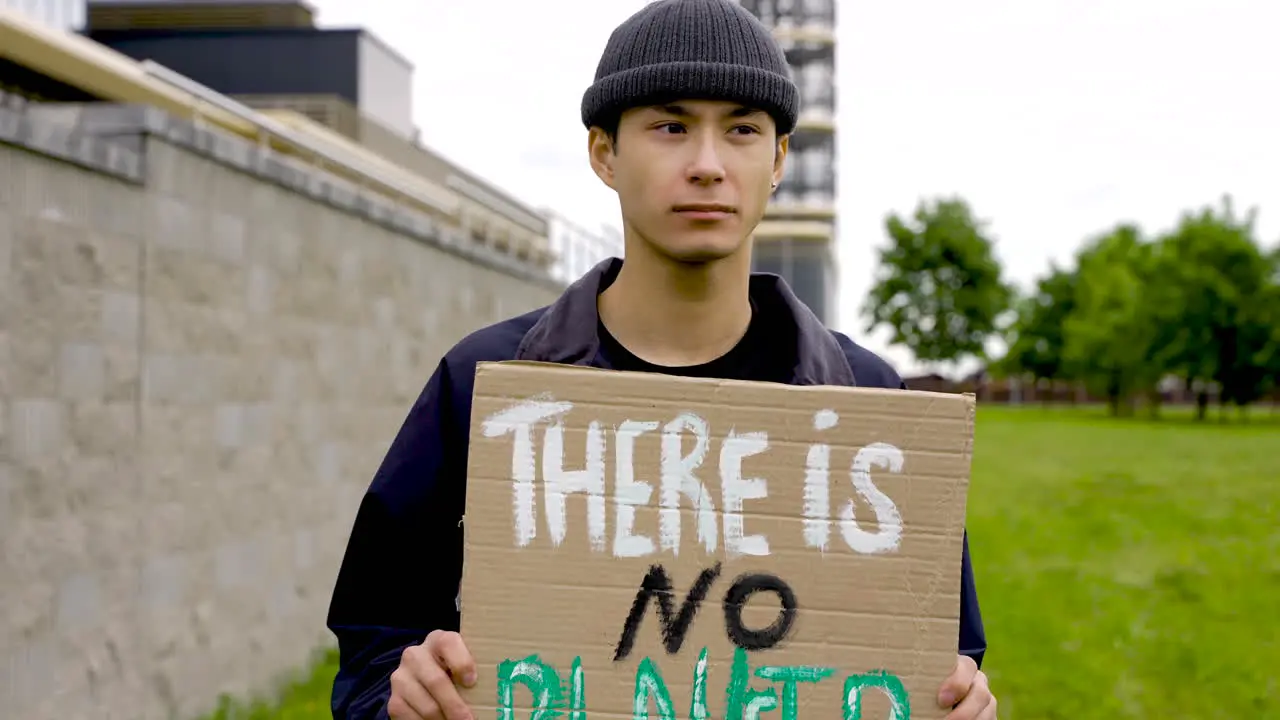 Close Up Of An Man Holding A Placard