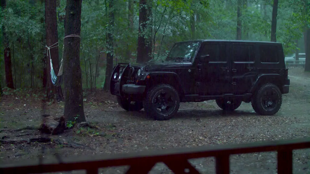 Jeep in driveway on rainy day