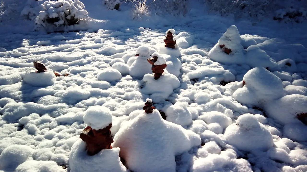 Cairns covered by snow at Bell Rock in Sedona Arizona