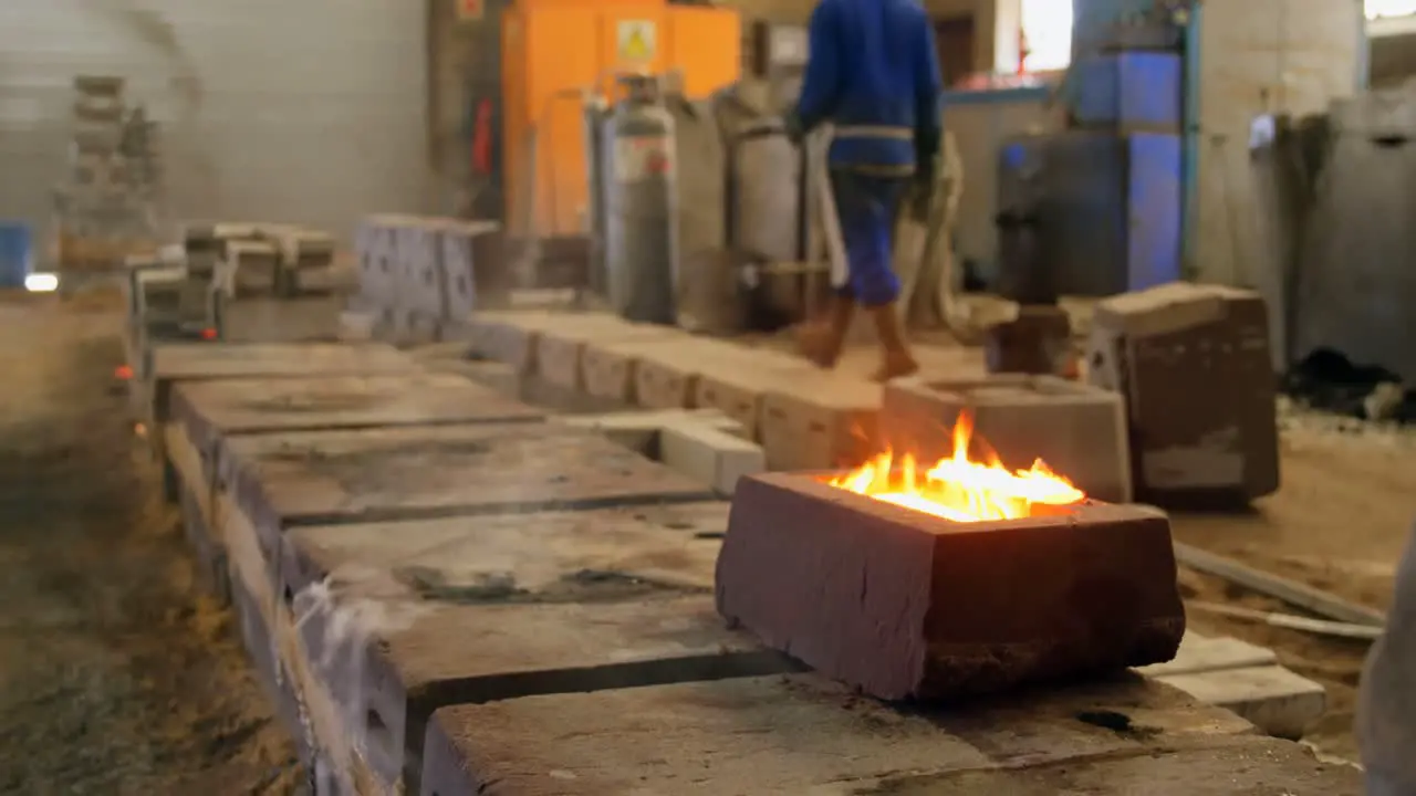 Molten metal being turned into molds in workshop 4k