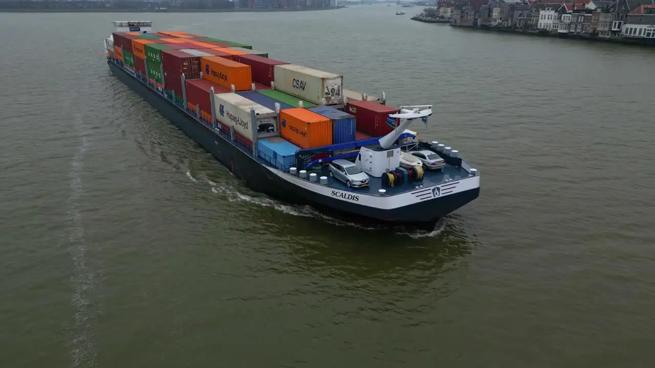 Aerial View Of Scaldis Container Ship Navigating Along Oude Maas On Overcast Day In Dordrecht