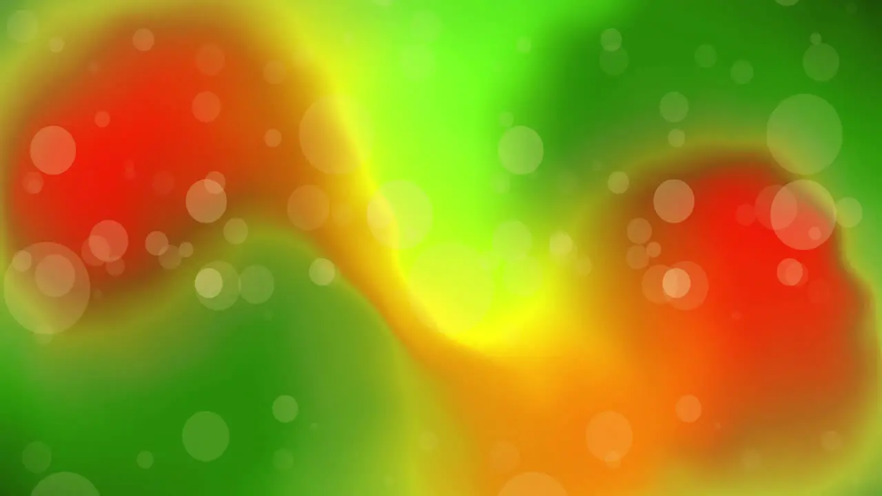 Animation of white light orbs over green and orange lights