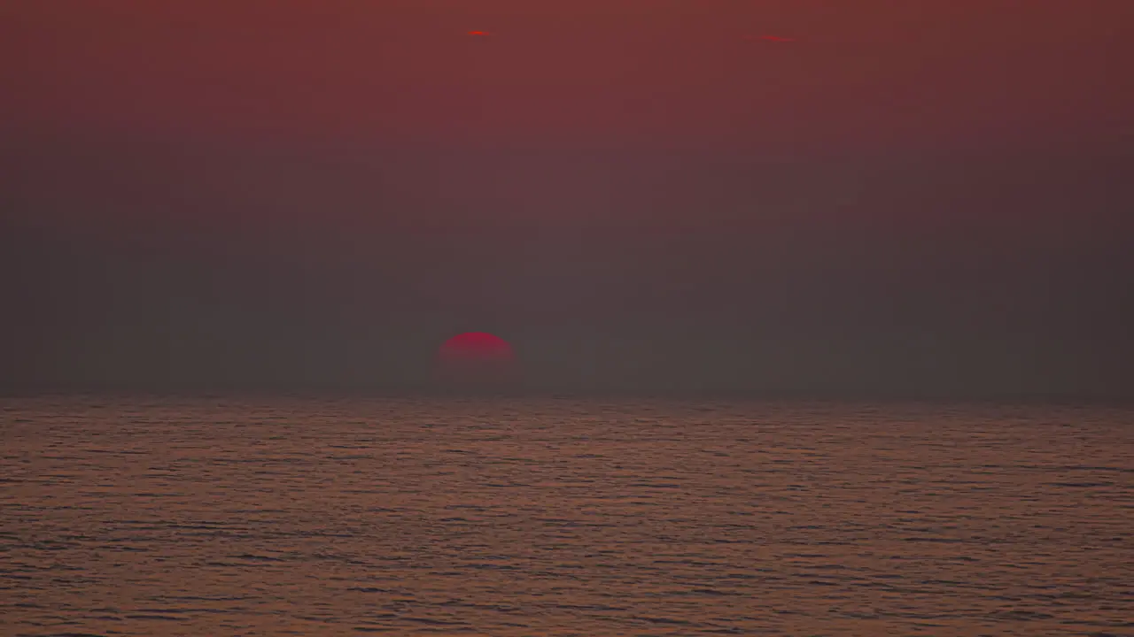 Bright Orange Sun Rising Over The Sea At Sunrise