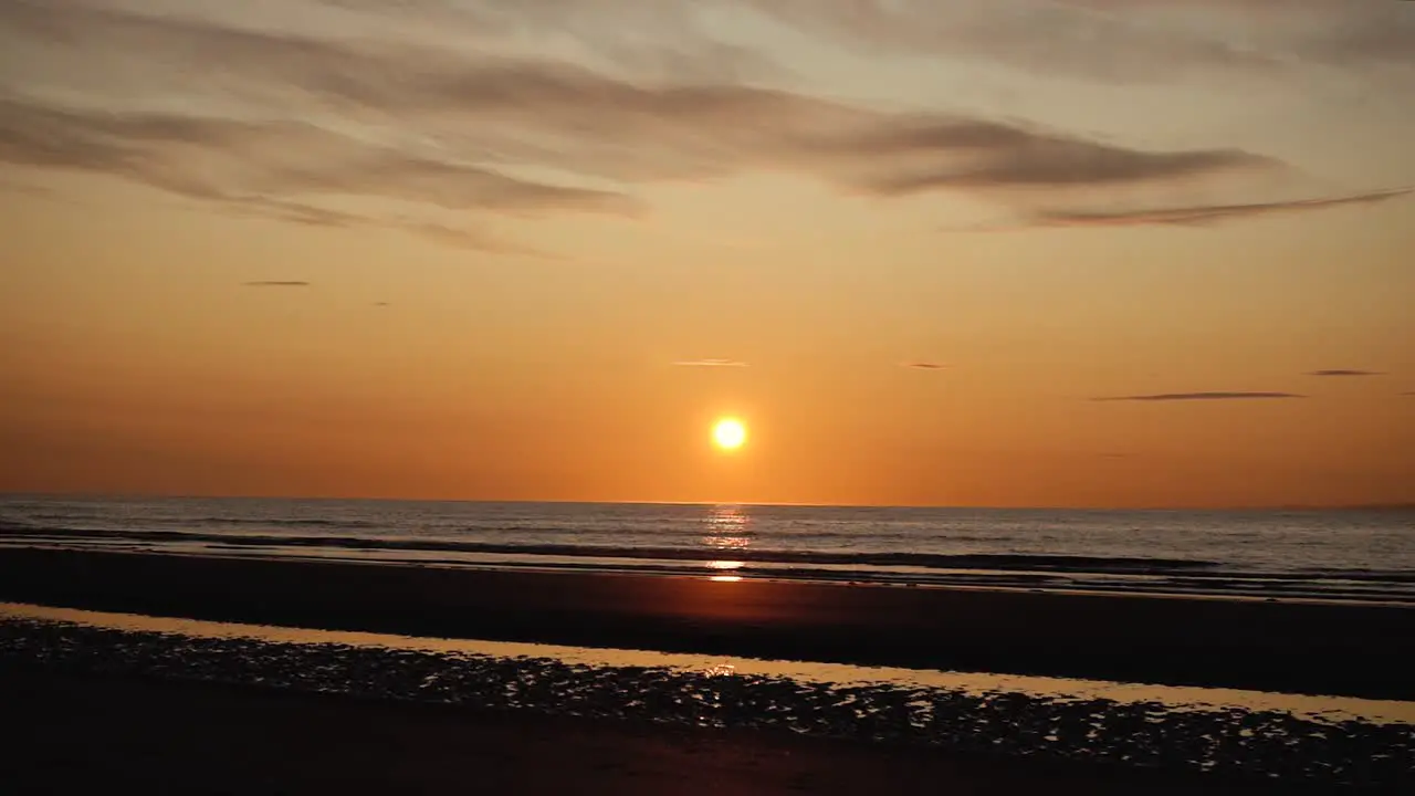 Man running with guitar in back sand beach at sunset-27