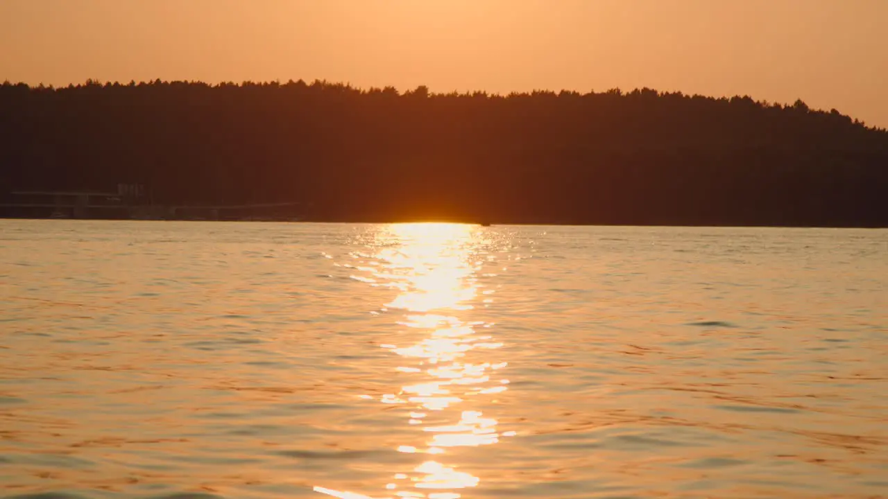 Red sunset on the lake slow motion