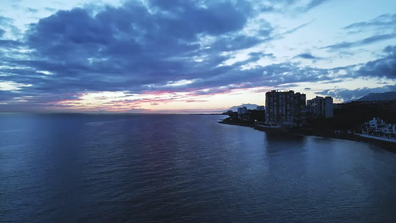 Cinemagraph loop of aerial view of the shoreline during sunrise or sunset