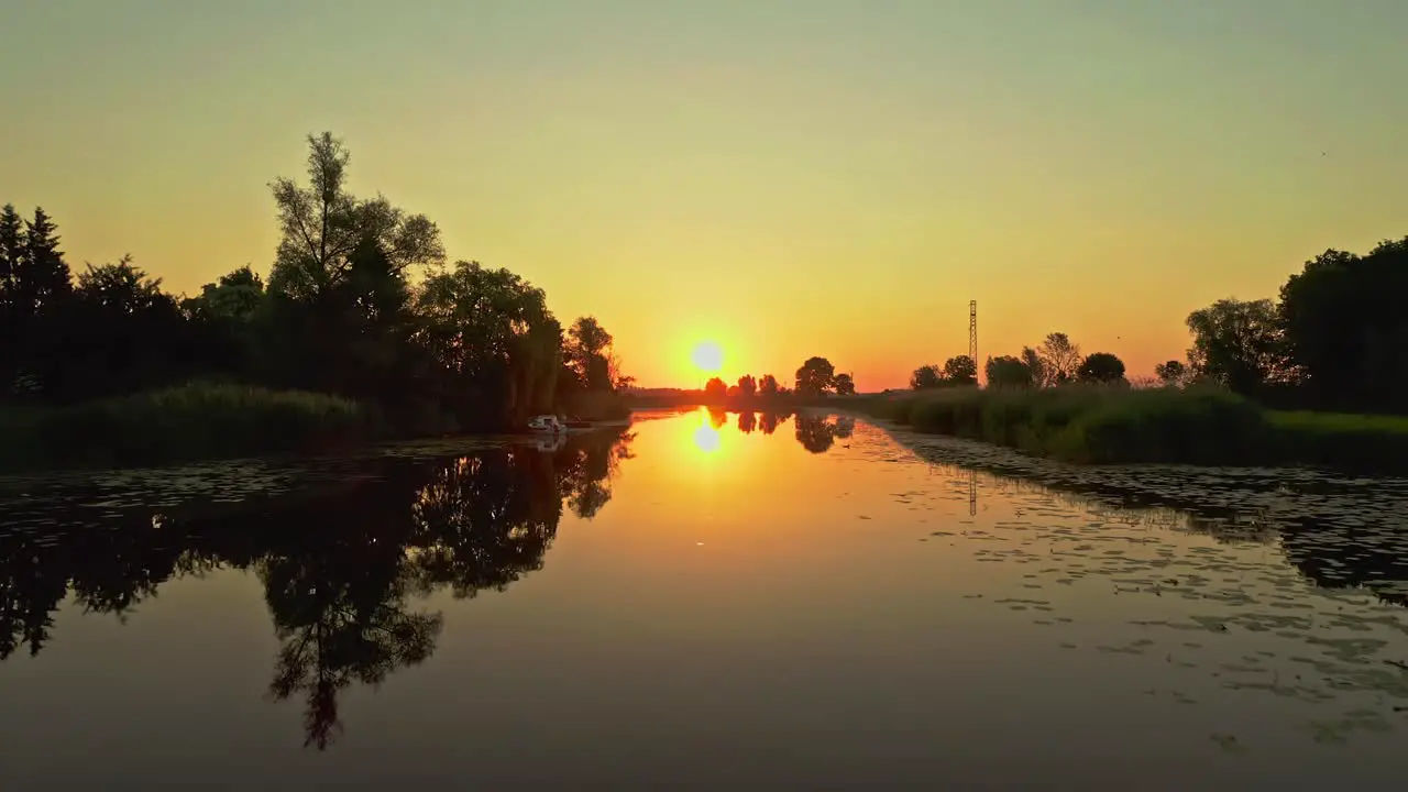 Drone Aerial Sunrise shot with beautiful reflections above the water