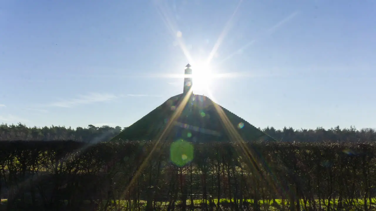 wide shot Time lapse of sun appearing behind obelisk on Austerlitz Pyramid