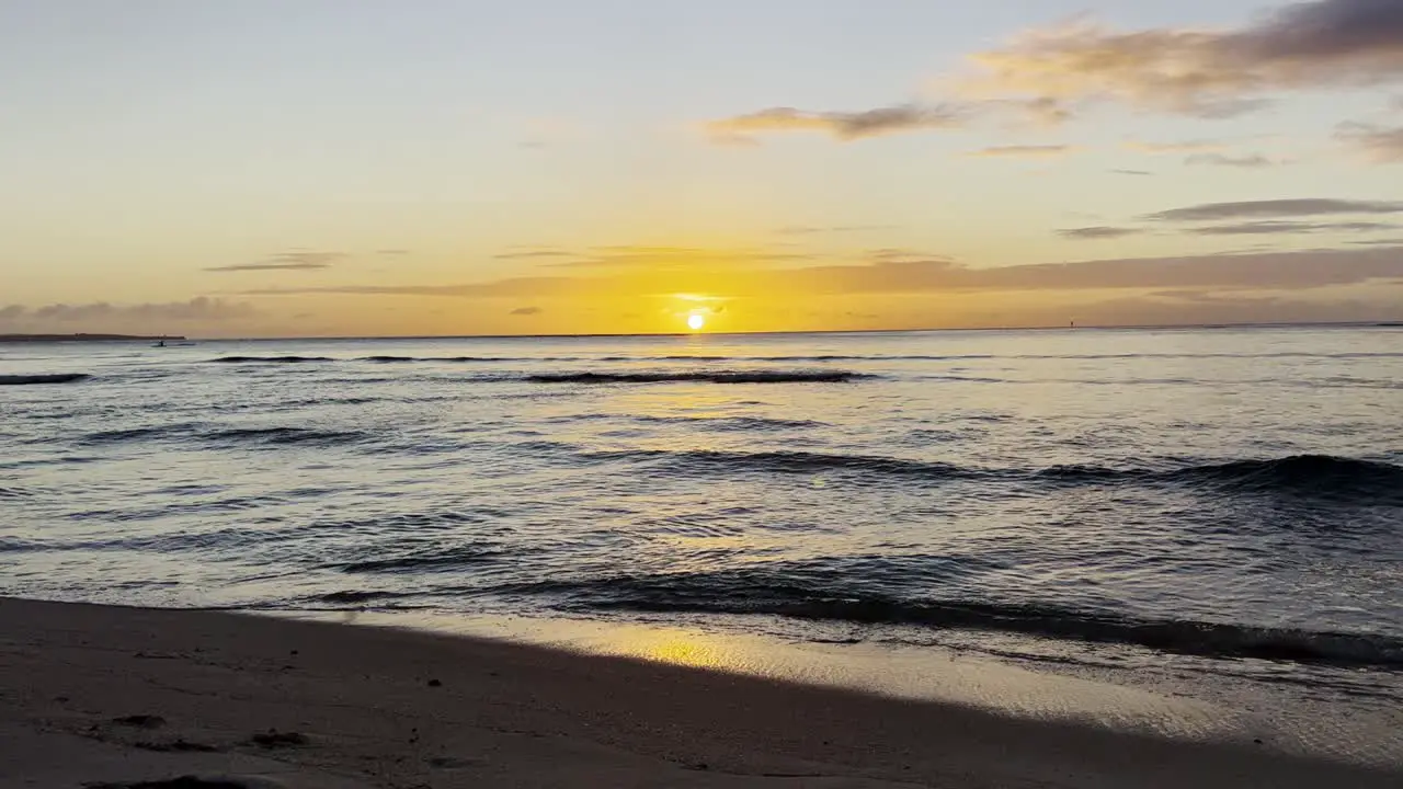 Waves at the beach during sunset slow motion