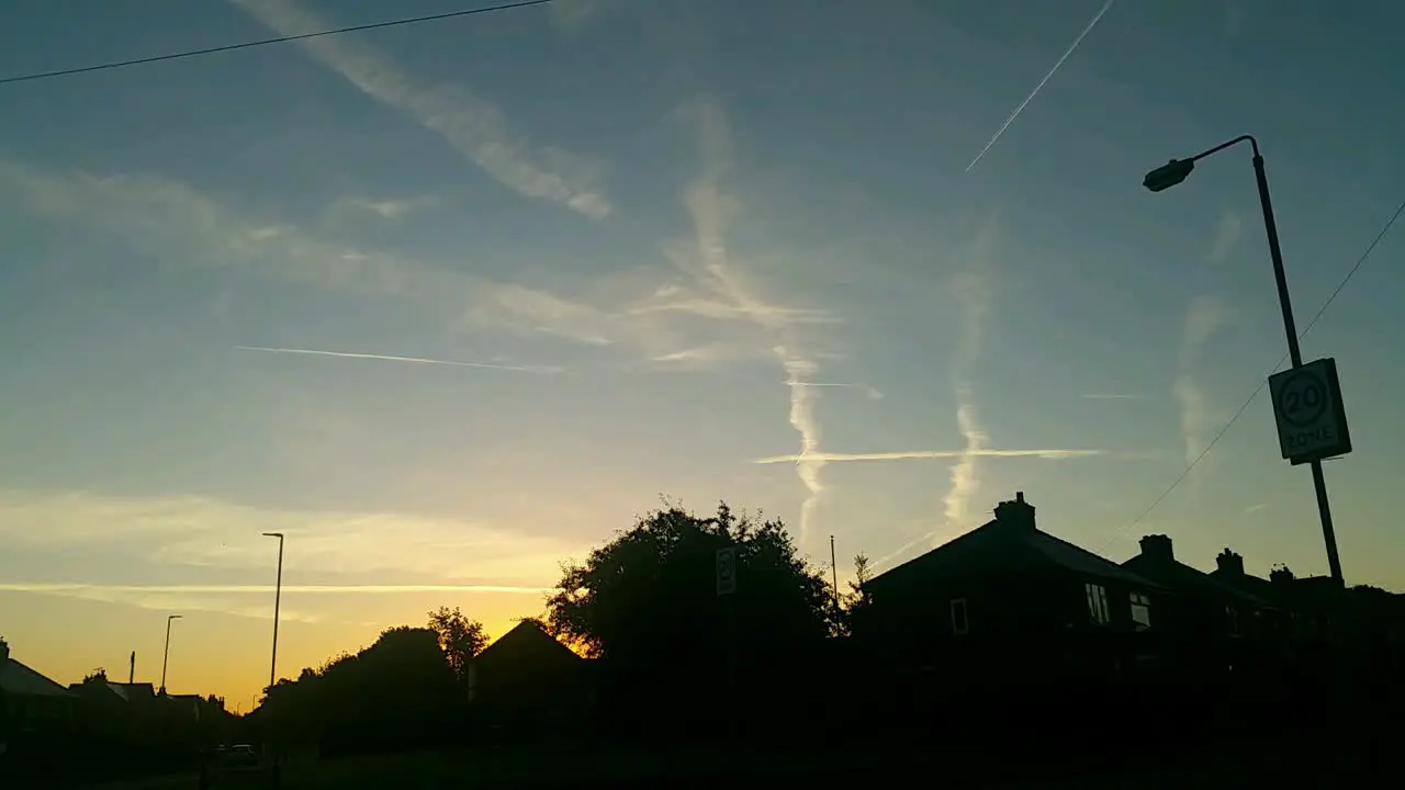 Morning sunset time lapse with passing aircraft