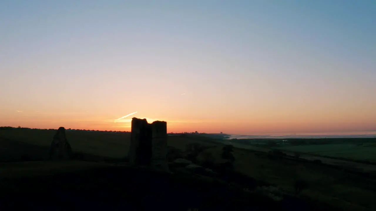 Sunrise fast pan to right Hadleigh Castle Morning two towers shows ruins