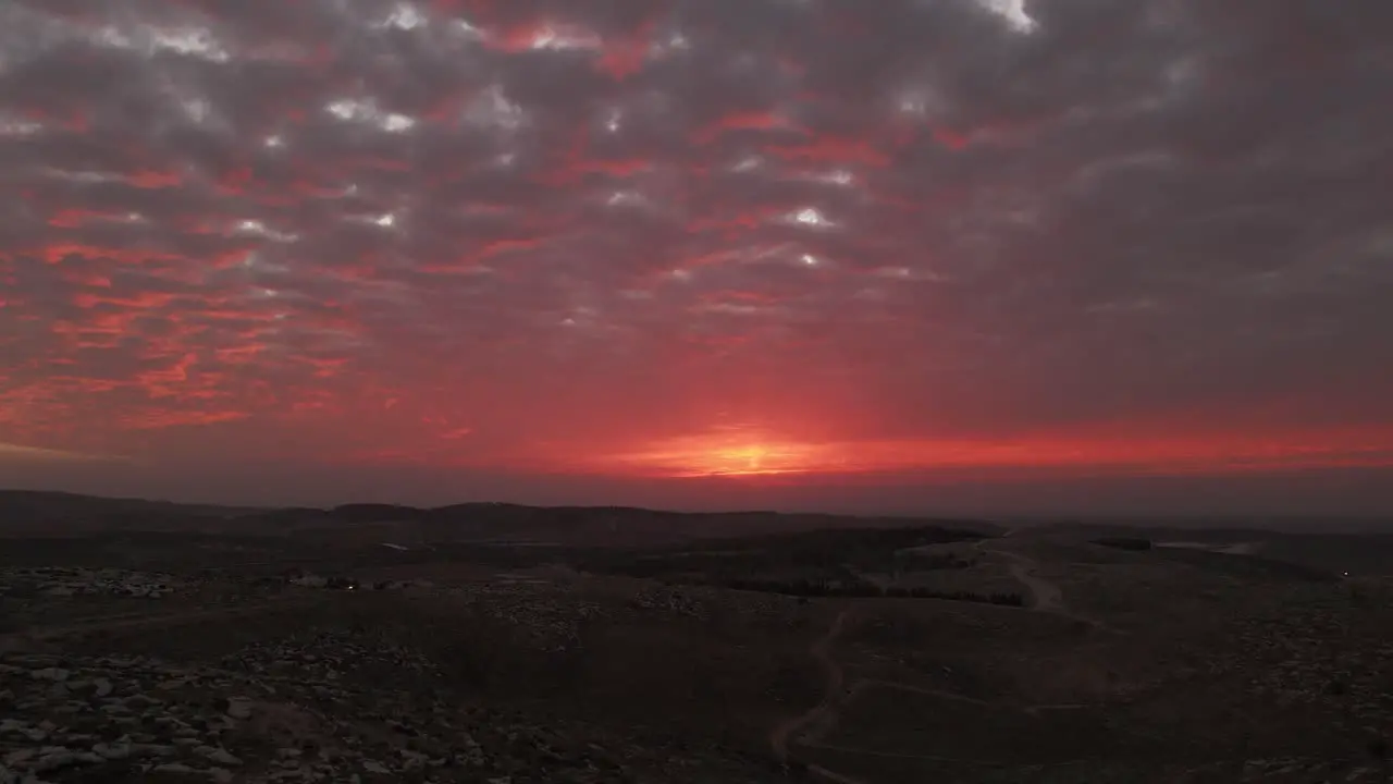 Aerial shot of a vibrant sunset over the landscape of Israel