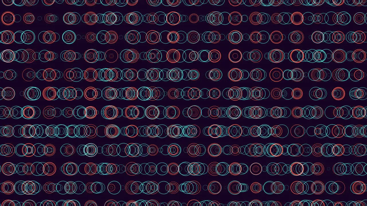 Symmetrical red and blue circles in circular pattern on dark background