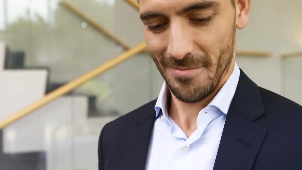 Businessman using mobile phone in stairs 4k