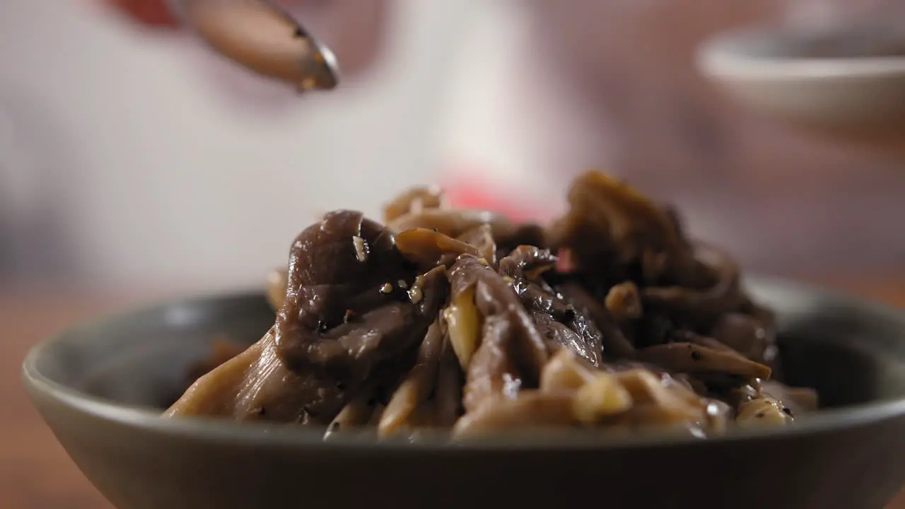 Chef prepares Mediterranean hummus with mushrooms dish-1